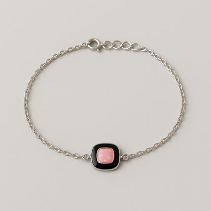 Elegant Silver Chain Bracelet with Pink Stone Centerpiece